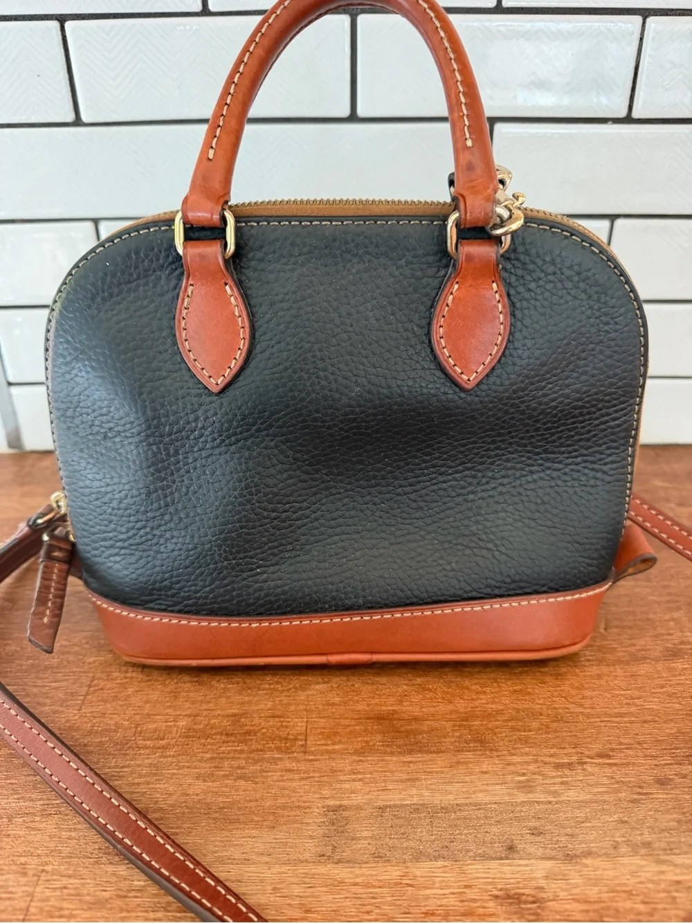 Dooney & Bourke Black with Brown Trim Pebbled Leather Dome Satchel